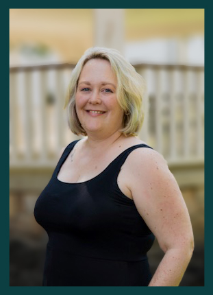 Emily Foch, Settlement Agent for North Central Settlement Services. She is a blonde woman wearing a black tank top, and is smiling.